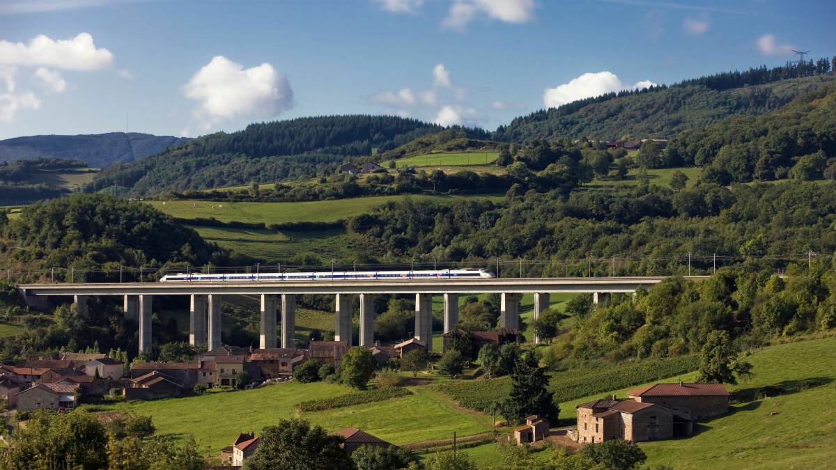 The future? A French high-speed train, or TGV, crosses a bridge in the Burgundy countryside of France