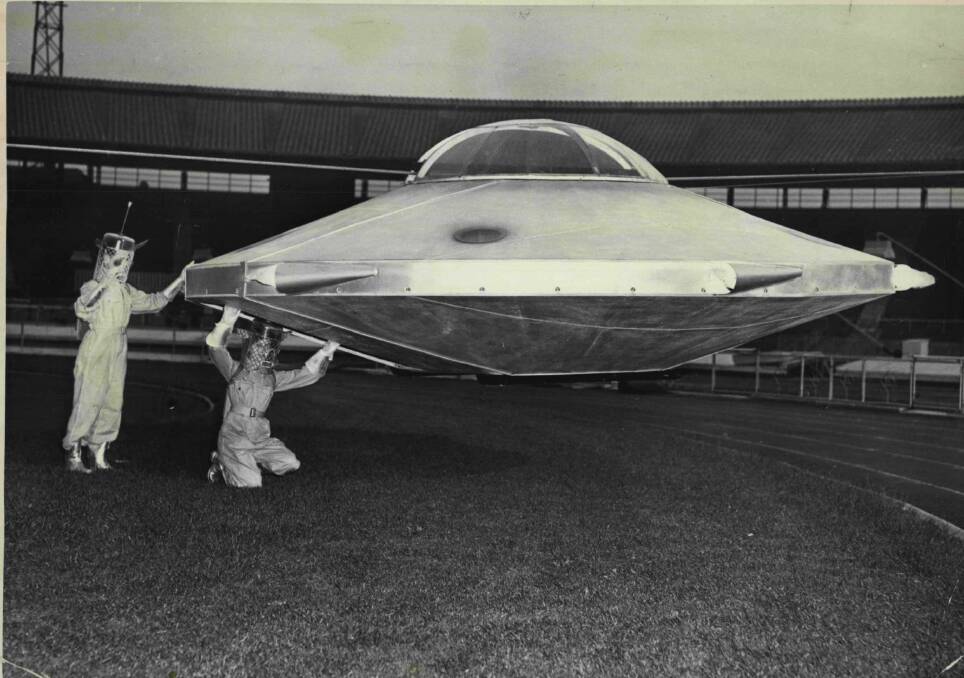 ET, come into land: Two "Martians" get ready to drop in on the 1955 Spotlight Tattoo in London. Picture: Fox Photos 
