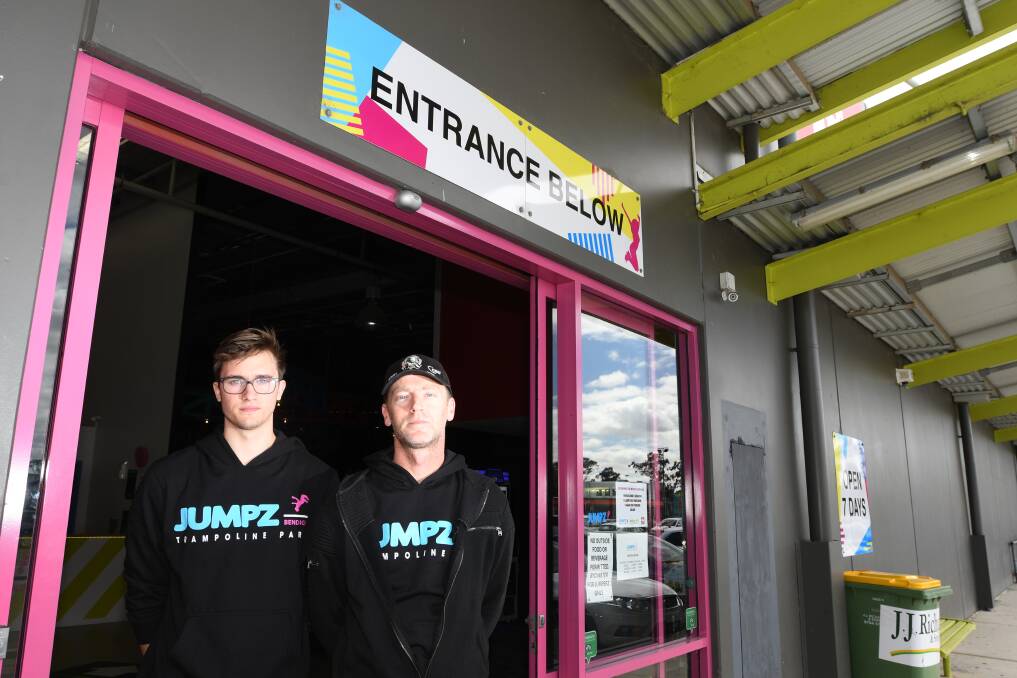 DISHEARTENING: Jumpz Trampoline Park staff members Jack Anderson and Mark O'Hehir outside the Kangaroo Flat business. Picture: NONI HYETT