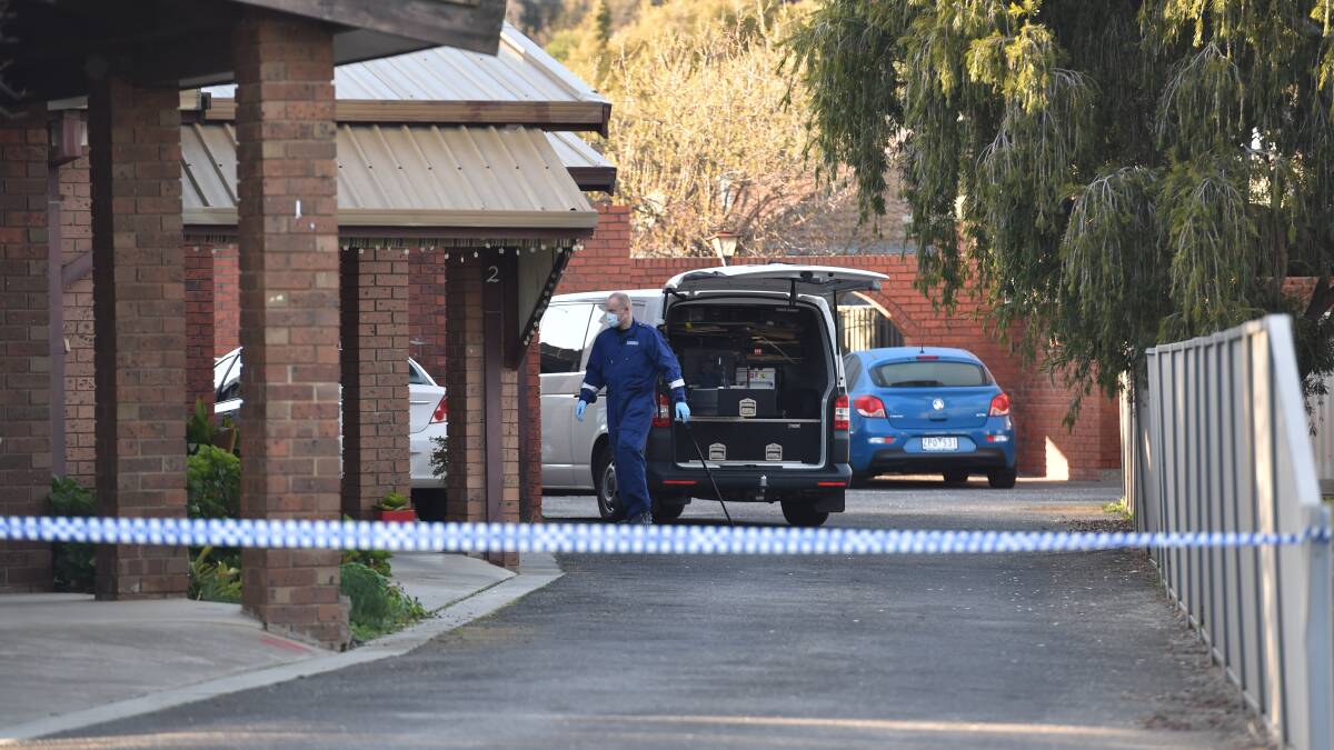 Forensics investigate the scene this morning where a woman was found dead in Mijuda Court, Kennington. Picture: Jodie Wiegard