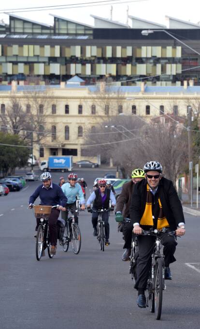 ROLLING: Business workers are giving riding to work a big push. City of Greater Bendigo's Andrew Cockerall leads the charge in a ride. Picture: BRENDAN McCARTHY.