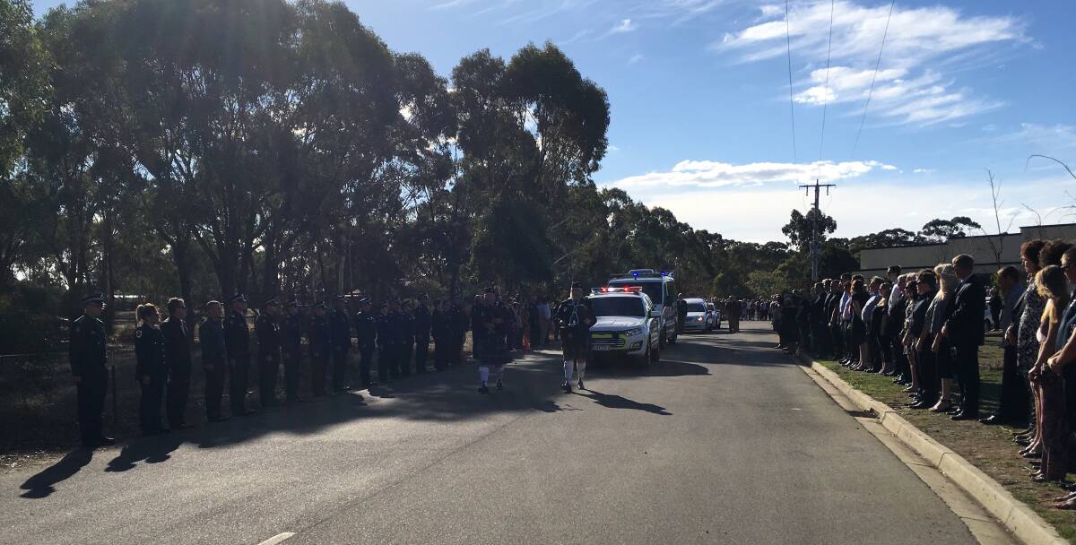 GUARD OF HONOUR: Emergency services officers, footballers and netballers lined the exit to the church on Friday as Owen Curnow was farewelled.