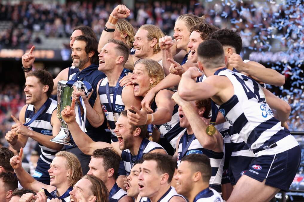 Geelong celebrate after winning the 2022 AFL Grand Final against the Sydney Swans. Photo by Cameron Spencer/AFL Photos