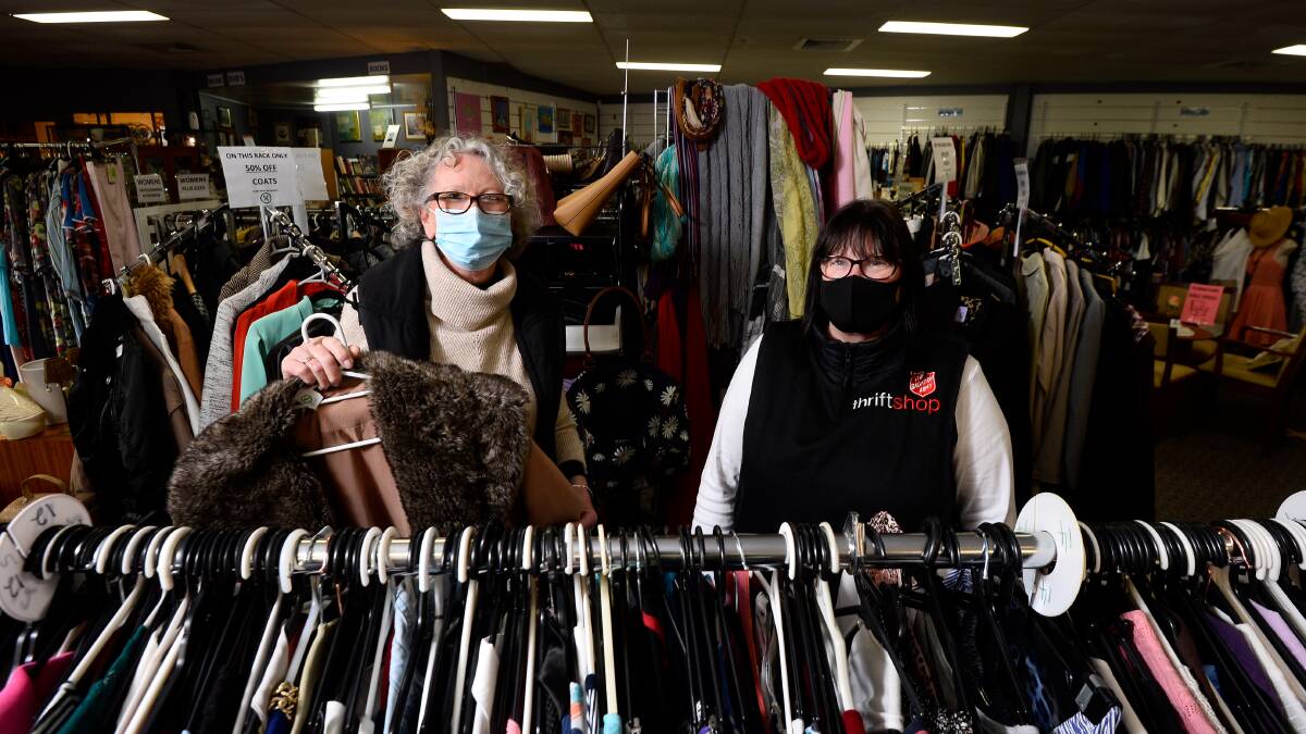SHORTAGE: Volunteers Marie Lyons (left) and Diane Lindsay at a Salvation Army thrift shop. Picture: Adam Trafford