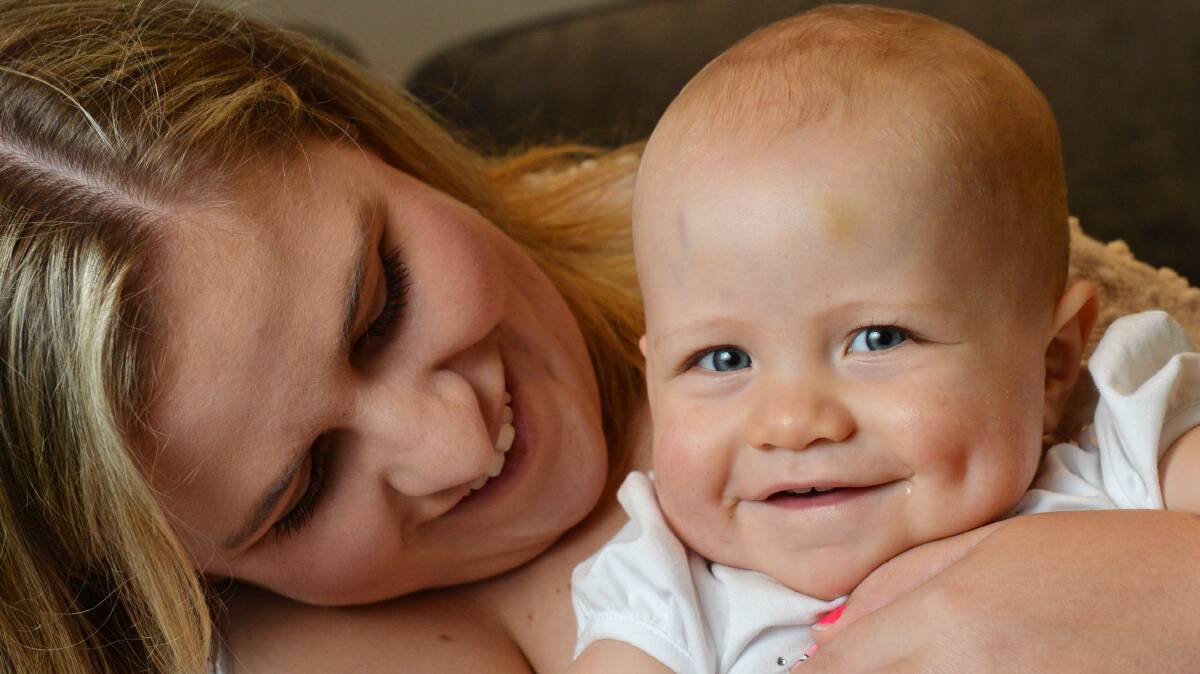 HOPE: Mother Skye Whiteman cuddles up with her daughter Brydee, 1, who has a rare form of leukaemia and will undergo a bone marrow transplant in March. Picture: DARREN HOWE
