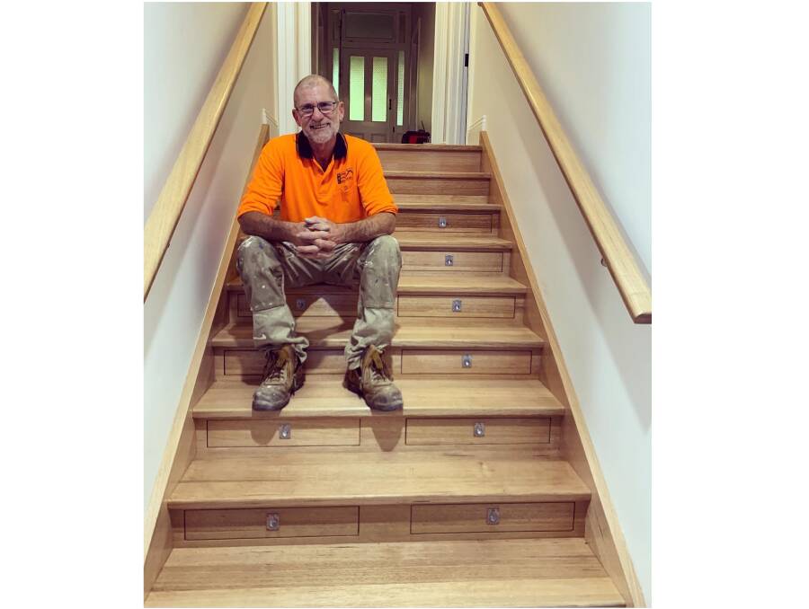 Murray Berrill sits on the staircase he built that was later shared around the world. Pictures supplied by Trilby Langdon and Murray Berrill