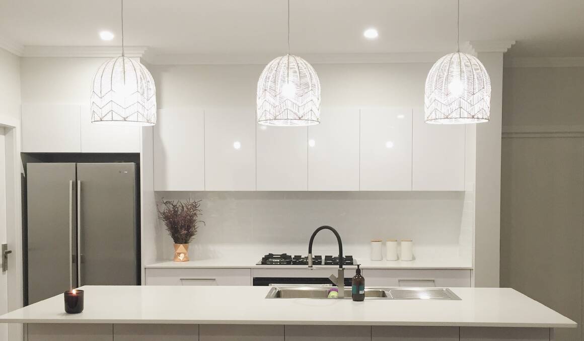 HIGHLIGHT: Don’t underestimate what lighting can do to set off the kitchen, hanging a few pendant lights over an island bench can really add pizazz. Photo: Style My Space.

