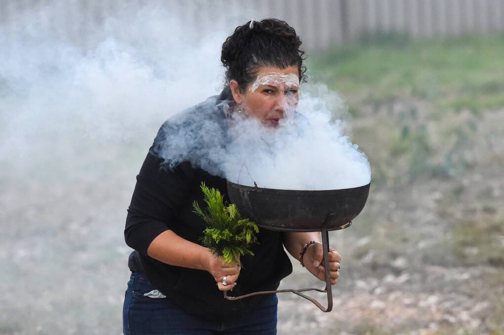 SMOKING CEREMONY: Bec Phillips does a smoking ceremony to cleanse a local site in 2021. Picture: DARREN HOWE