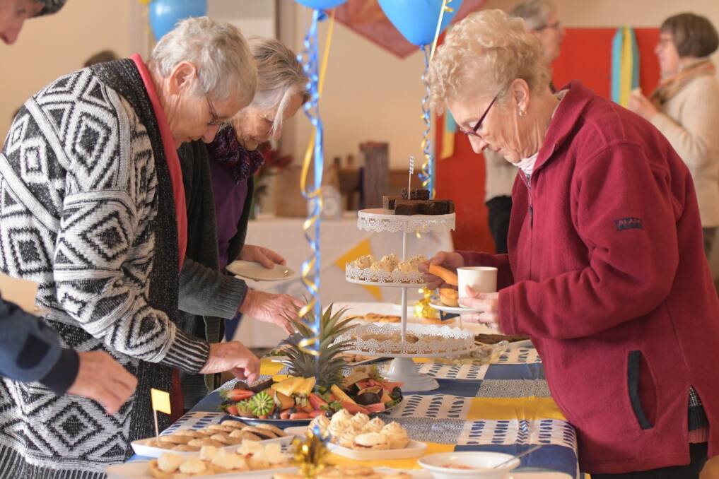 FUNDRAISER: Helping cancer research, the morning tea crowd.