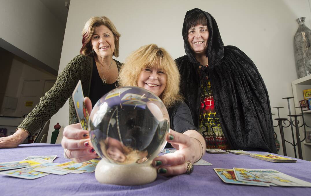 WITCHCRAFT LESSONS: Gaye Washington (centre) shows Bronwyn Griffith and Johanna Hobson the ins and outs of scrying. Picture: DARREN HOWE 