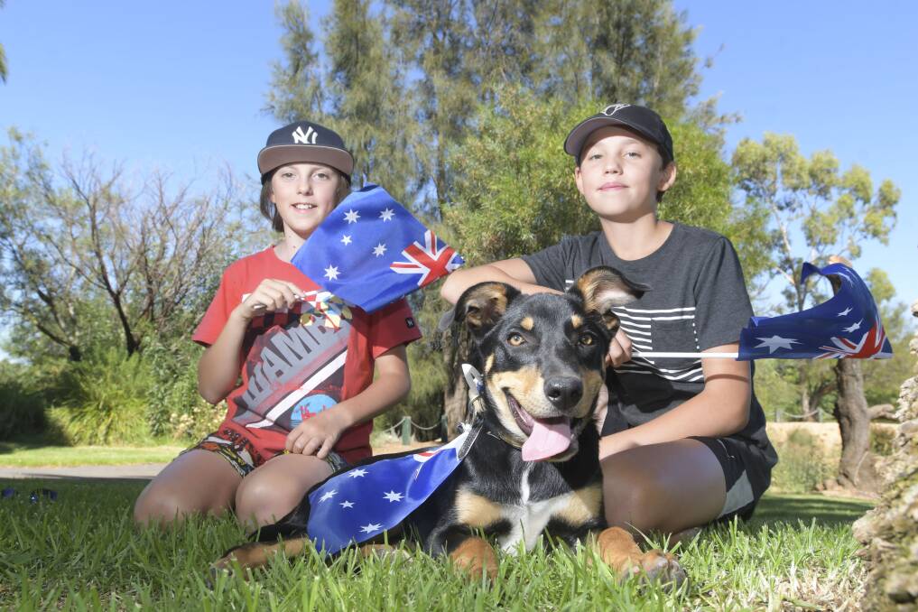 POOCH PAL: Murray and Lincoln with Bandit the dog at the 2019 Australia Day Celebrations at Lake Weeroona. Picture: NONI HYETT
