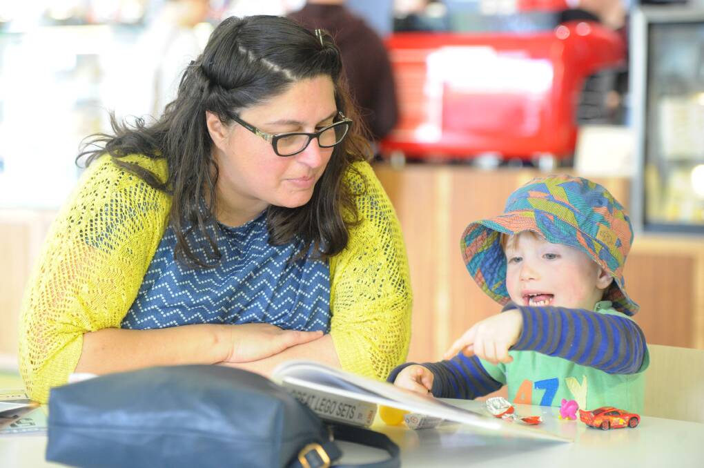 STORY TIME: Geraldine and Gabriel Micallef have fun at the Bendigo Library. Picture: JODIE DONNELLAN