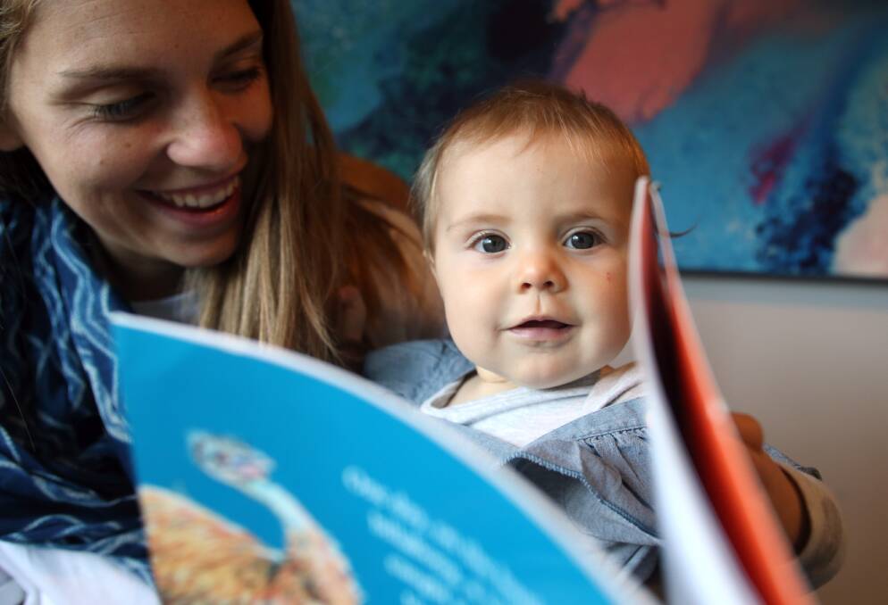 TIME TO READ: Josie and her mother Alicia White read at least three times a day. Picture: GLENN DANIELS 
