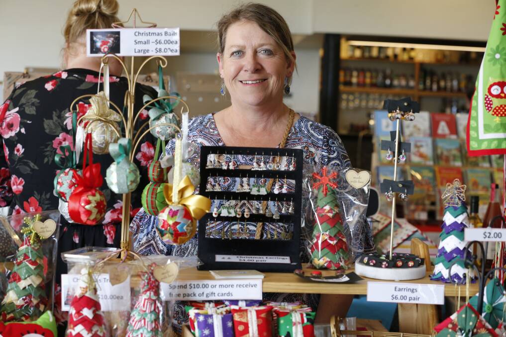 MARKET FUN: Fiona Turnbull at her Christmas stall. Picture: EMMA D'AGOSTINO 