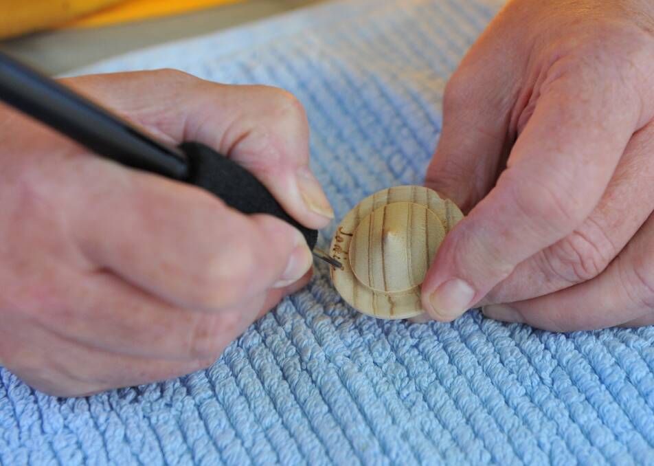HAND CRAFTED: A member of Bendigo Woodturners Inc. creates a unique item. Picture: JODIE DONNELLAN 