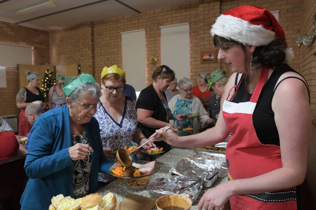 Community members enjoy a Christmas lunch in 2018. Picture by Noni Hyett