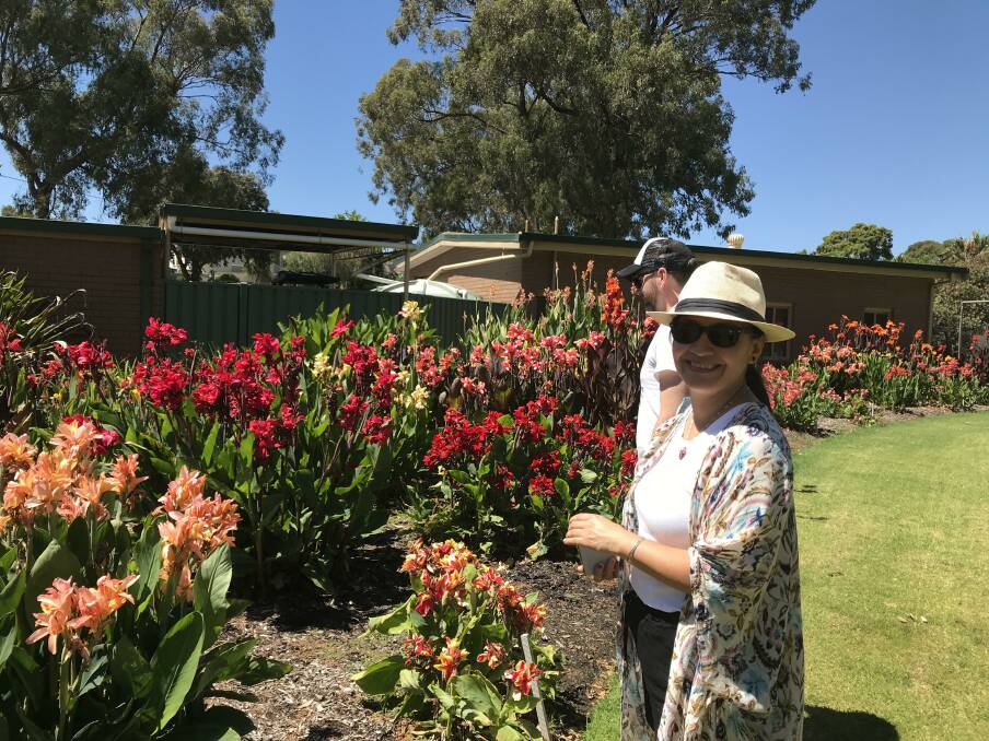 PLANTS AND FLOWERS: Melbourne visitors admiring the Canna Lily Collection in the Botanic Gardens. Picture: SUPPLIED