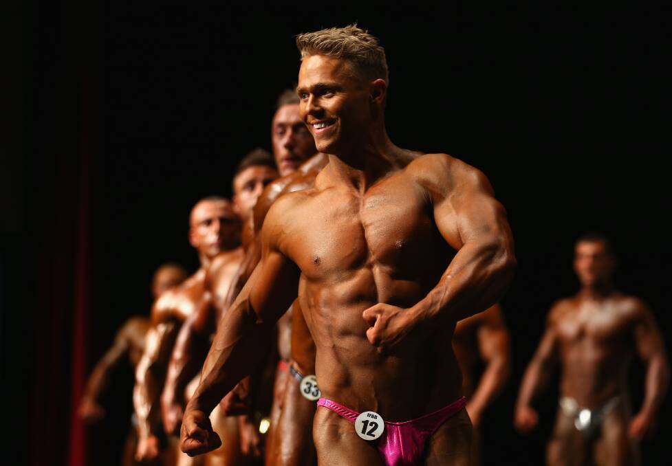 BODYBUILDING: Competitors on stage during prejudging for the 2014 IFBB Victorian Bodybuilding Championship on October 5, 2014 in Melbourne. Pic: Robert Cianflone, Getty Images