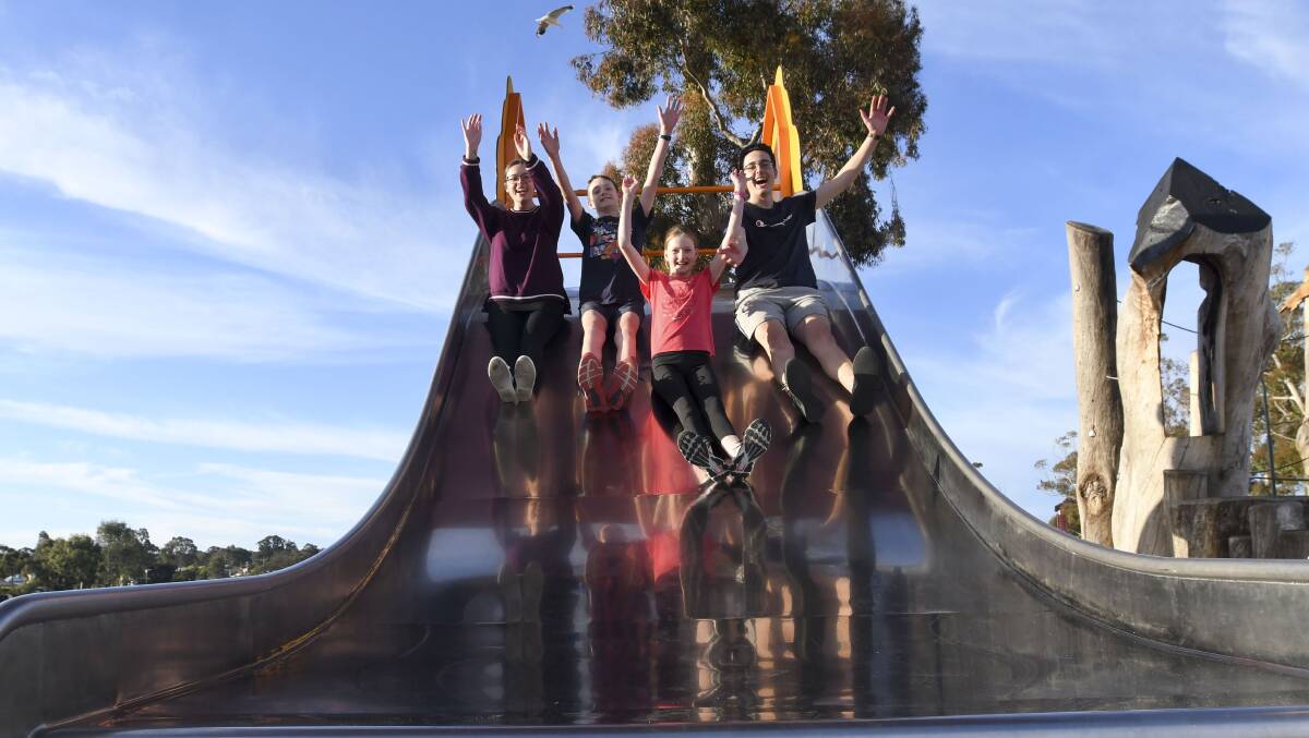 Yonah Parkinson, Logan Poke, Madison Poke and Lachlan Parkinson have fun at the Eaglehawk Playspace. Picture by Noni Hyett