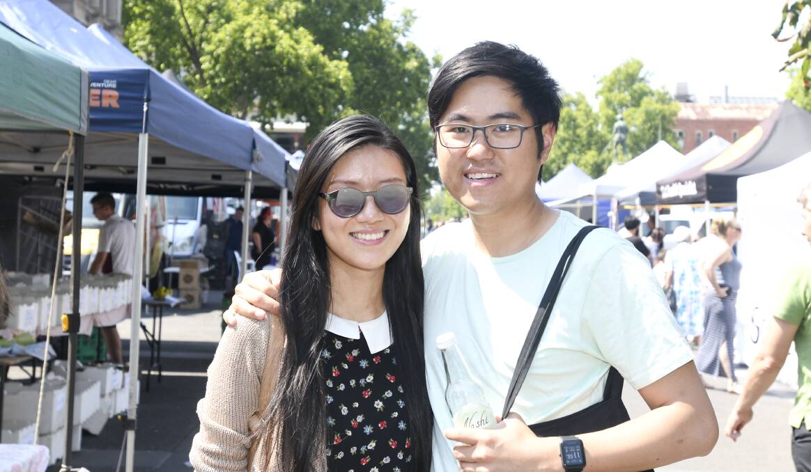 MARKET FUN: Linda Ly and Kevin Sek enjoy a day out at a local farmers market. Picture: NONI HYETT. Please note, image taken before COVID-19 restrictions.