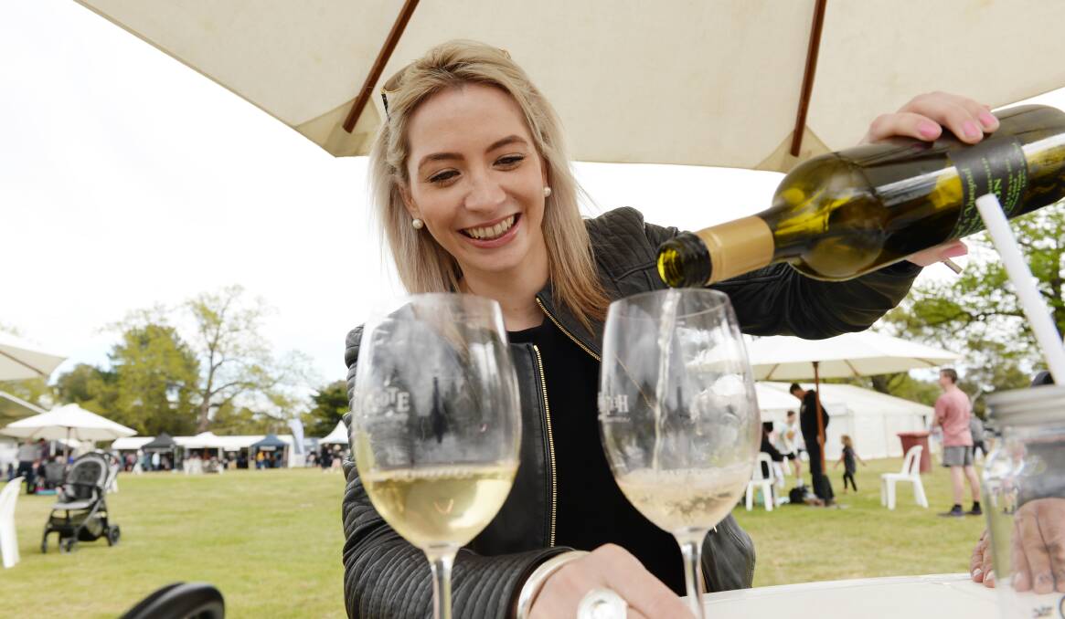 FOOD AND WINE: Jeanine Vandenbosch tries wines at a local festival. Picture: DARREN HOWE