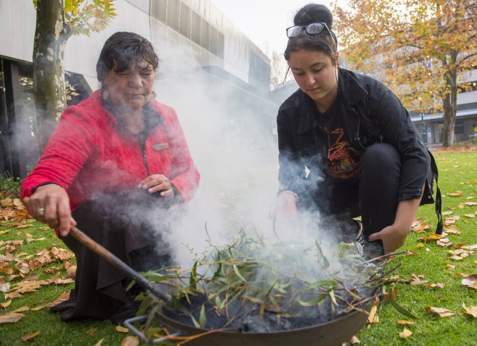 CEREMONY: A Smoking Ceremony at the Bendigo Library gardens to mark Reconciliation Week in 2019 with Auntie Marilyn Nicholls with Rhianna Kerr. Picture: DARREN HOWE