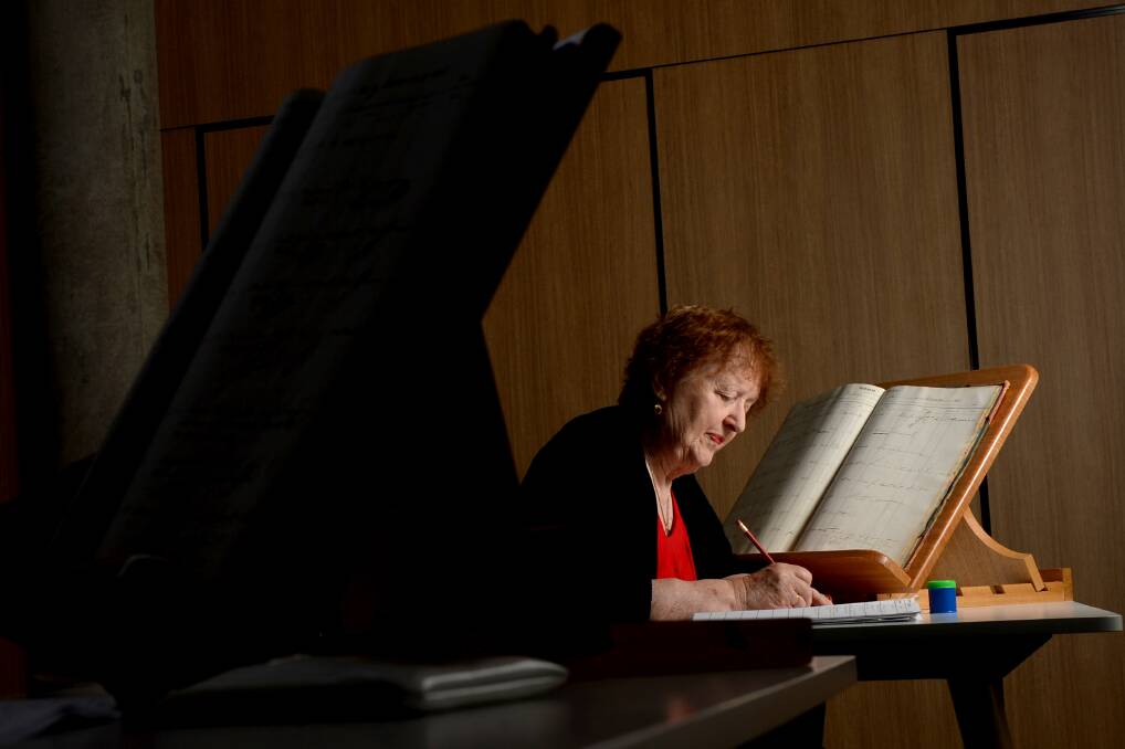 HISTORY: Genealogist Judy Pearmain studies old court records. Picture: DARREN HOWE
