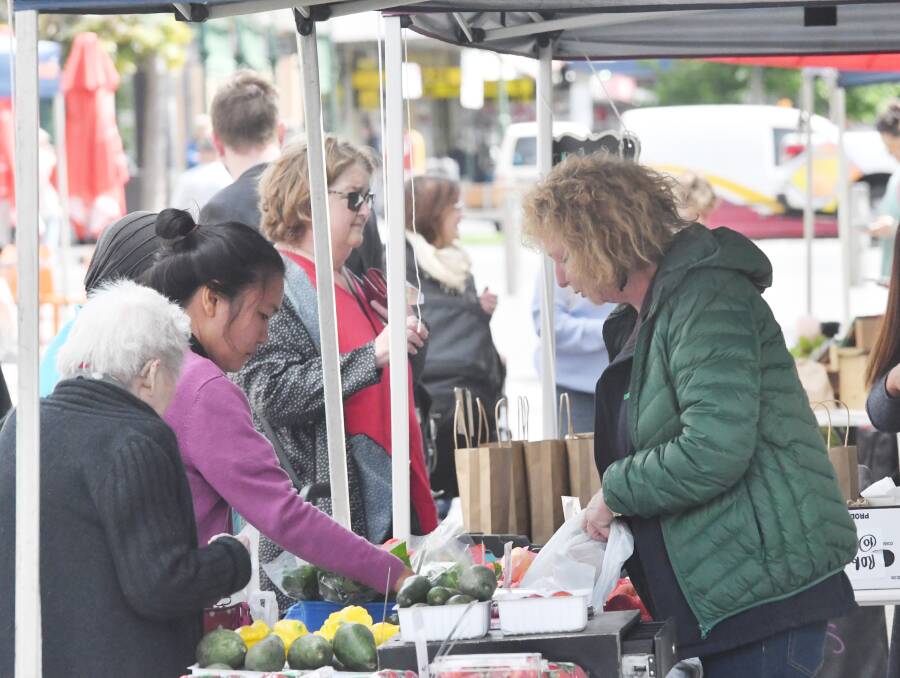 Farmer's market in Bendigo, community members gather to buy the freshest produce. Picture: DARREN HOWE