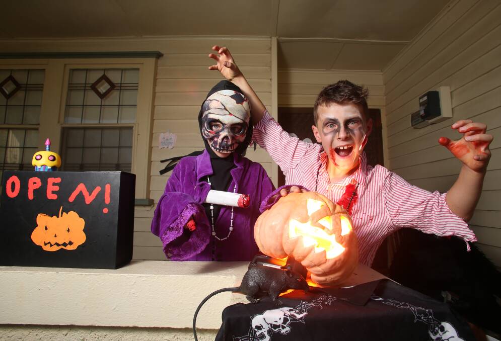 GHOSTS AND GHOULS: In 2019, Coen and Jacob Kendal created jack-o-lanterns and decorated their front yard for Halloween. Picture: GLENN DANIELS. 