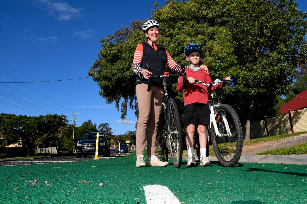 COMMUNITY RIDE: Bike Bendigo president Nicola Dunnicliff-Wells and her son Michael. Picture: NONI HYETT