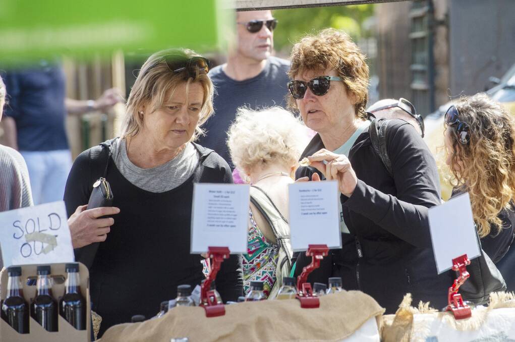 FRESH QUALITY: Heather Hall and Anne Rochford at a farmers market in January. Picture: DARREN HOWE