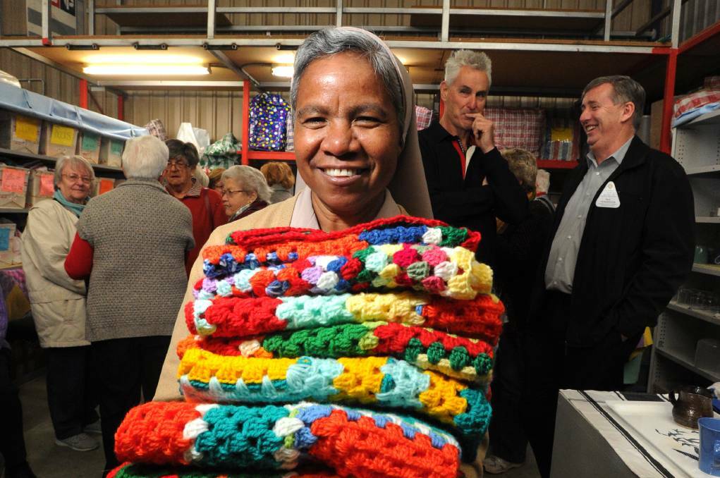 HANDMADE: Sister Inacia Mafalda Fatima of the Carmelite Sisters of East Timor with donations of handmade goods from Australia for mothers and babies back home in 2017. Picture: NONI HYETT.