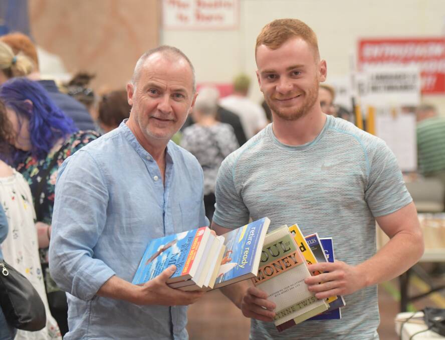 READY TO READ: Dan and Joe Rankins attend a book fair in Bendigo. Picture: NONI HYETT