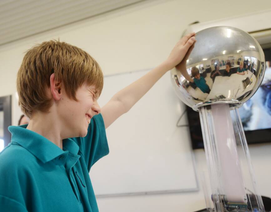 STATIC: Victory Christian College student Lachlan and the Van der Graaf machine for Science Week 2015. Picture: DARREN HOWE.