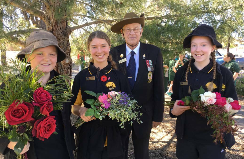 REFLECTIVE: Austin Robbins, Nyah Brits, John Handley and Chloe Flemming prepare to lay wreaths at the Kangaroo Flat service in 2016. Picture: SALLY SCOTT