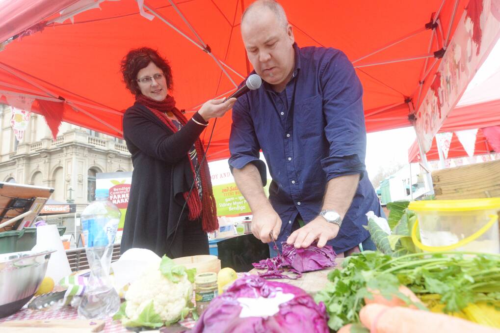 Guest chef Richard Cornish cooks withlocal produce at a Farmer's Market. Picture: DARREN HOWE