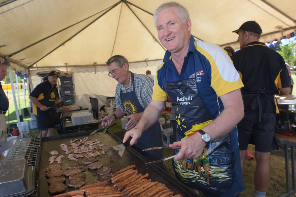 SAUSAGE SIZZLE: Ian Johnson and Allan Andrews cook some snags for the community at the 2019 Australia Day Celebrations at Lake Weeroona. Picture: NONI HYETT