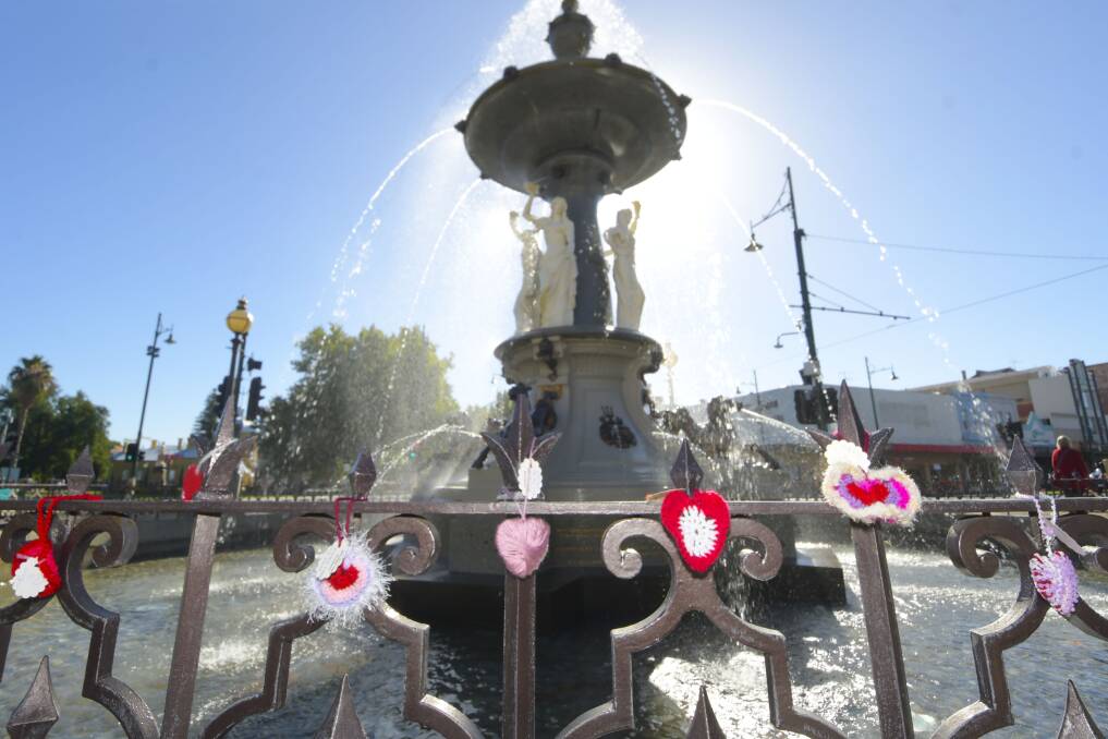 Bendigo Yarn Bombers strike the Alexandra Fountain with love hearts on Valentine's Day 2019. Picture: NONI HYETT