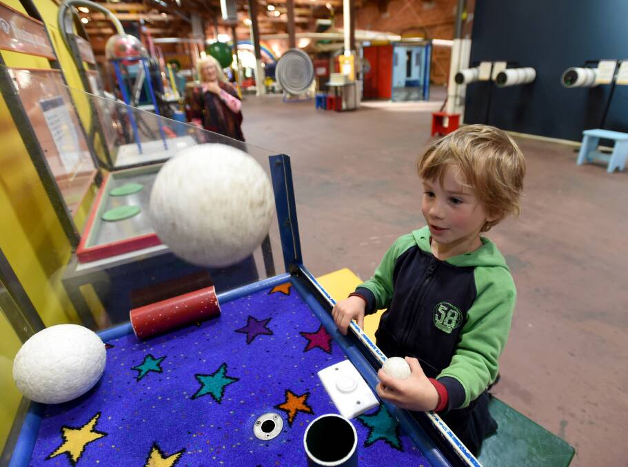 Charlie Cliff has some fun experimenting at the Discovery Centre. Picture: JODIE DONNELLAN