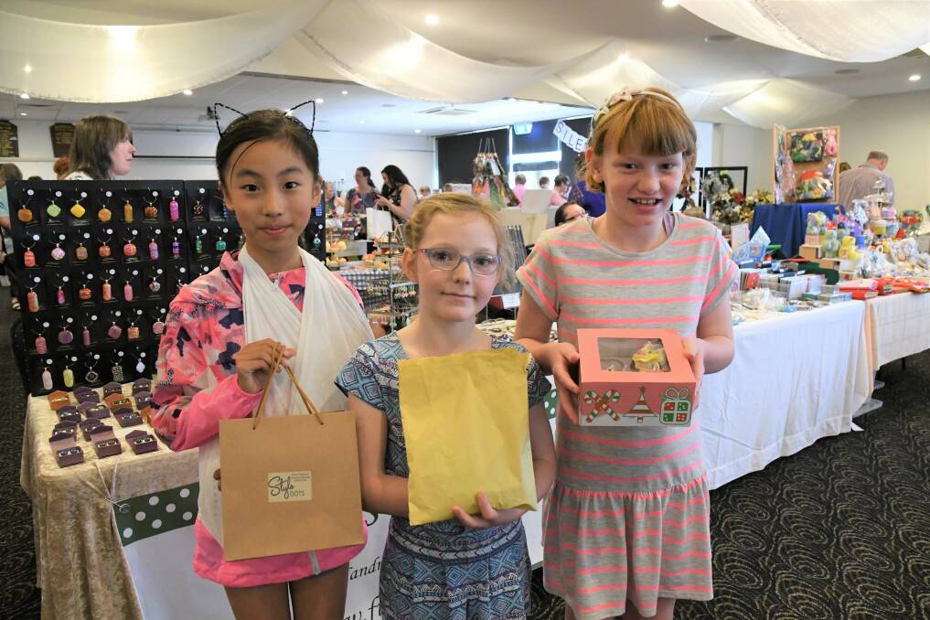 Dora, Chelsea and Jacana Marchesani with some treats from a Zonta market. Picture: BENDIGO ADVERTISER