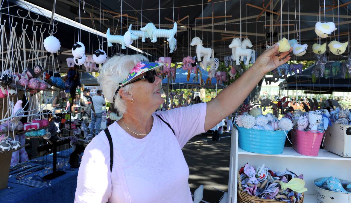 Brenda finds some goods at a local market. Picture: NONI HYETT