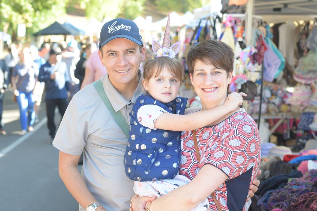 DAY OUT: Corey, Lauren and Claire Pysing enjoy the atmosphere at a central Victorian market. Picture: NONI HYETT