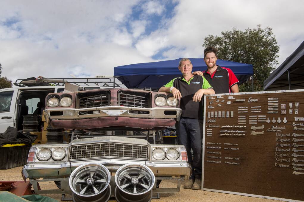 SWAP AND SELL: John and Matt Fishwick with vintage vehicles. Picture: DARREN HOWE