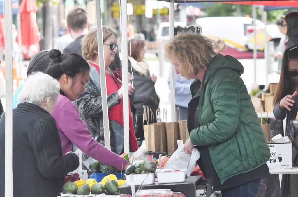 COMMUNITY: Locals attend a market in central Victoria. Picture: DARREN HOWE / FILES