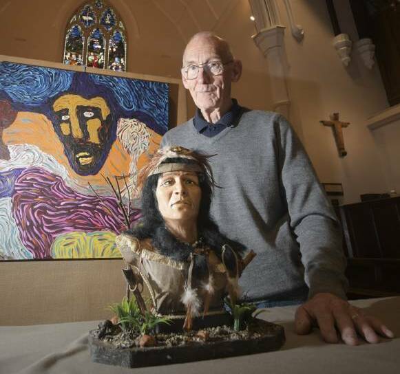 Reverend Ian Smith with two works that featured in last years exhibition. Picture: NONI HYETT
