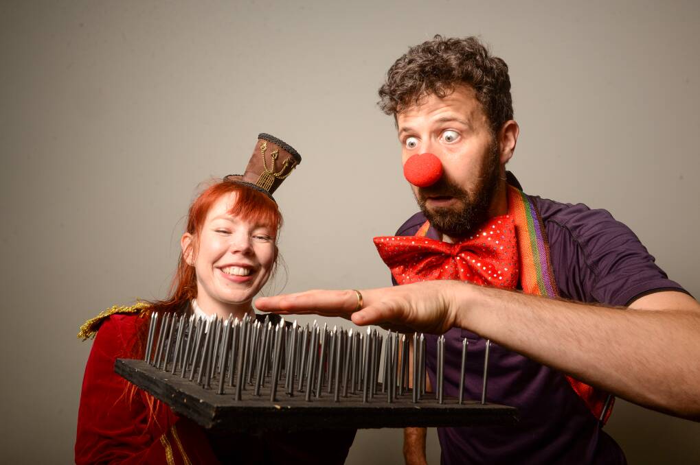 FUN SCIENCE: The Discovery Science and Technology Centre is exploring the science behind the circus with David Holmes and Alissa Van Soest. Picture: DARREN HOWE