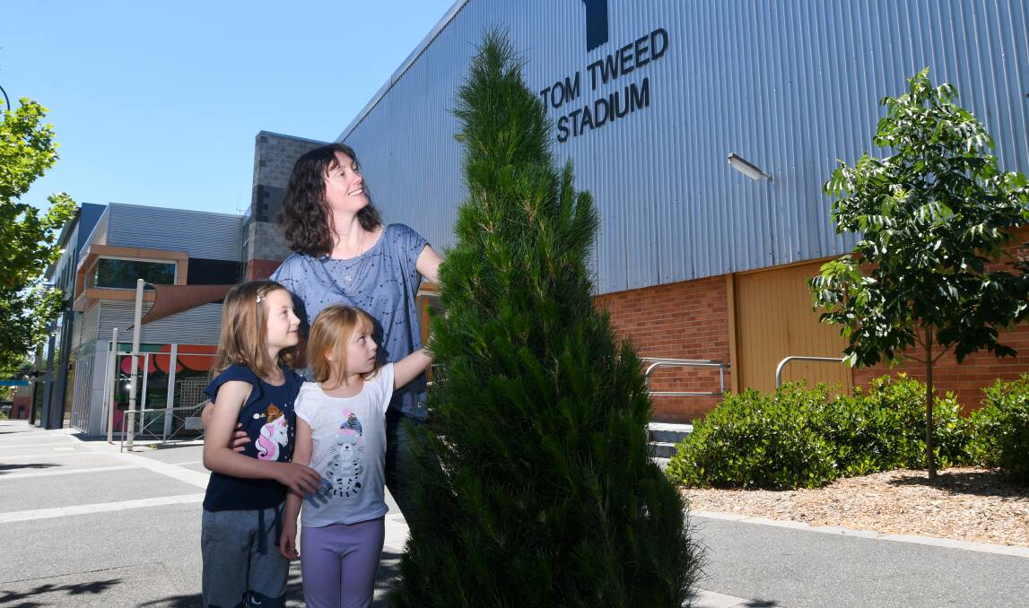 Y Service Club Christmas trees, with mum Melissa Abel and her two daughters Chloe and Lucy.Picture: NONI HYETT 