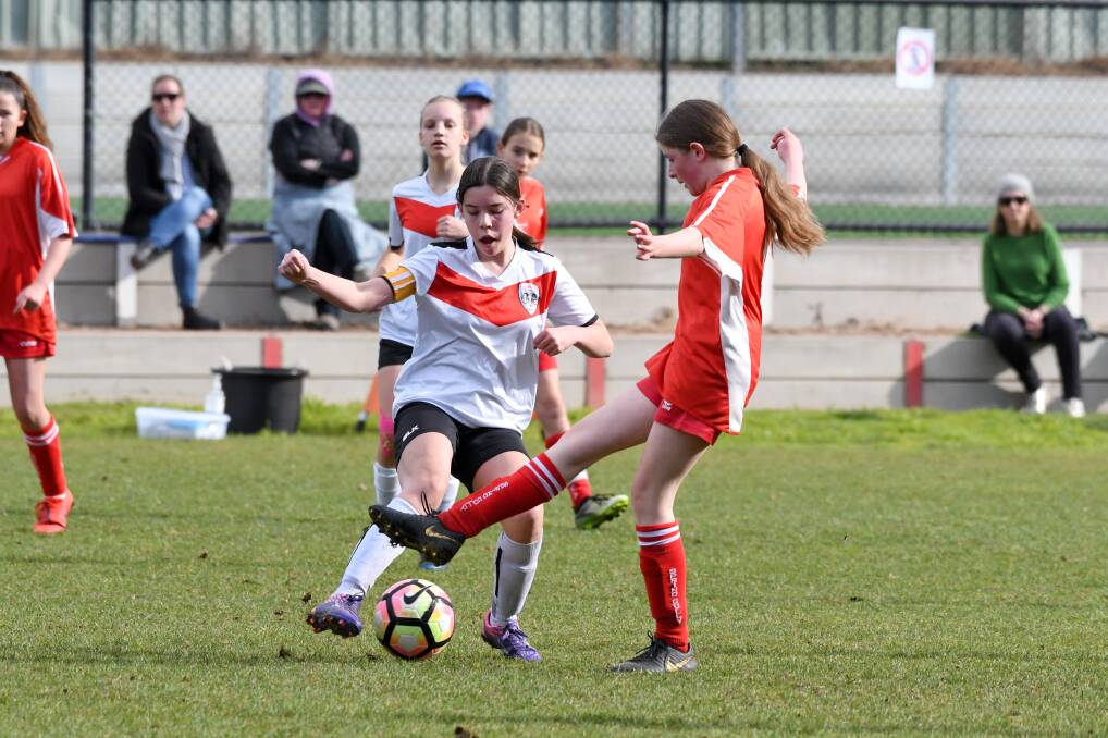 COULDN'T BE SPLIT: Spring Gully Red Stars and Golden City drew 1-1 in their under-14 girls match at Stanley Avenue on Saturday morning. Picture: NONI HYETT