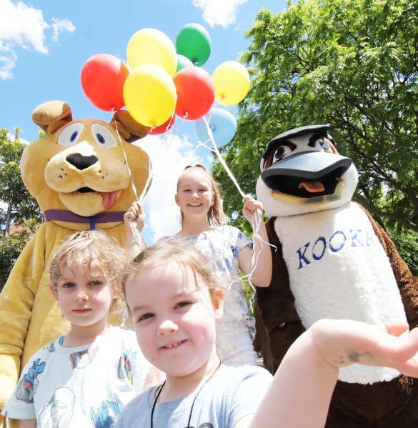 FAMILY FUN: Lilly and Charlie Williams and Millie Bennett with mascots Goldie the Dog from the City of Greater Bendigo and Kooka from the Bendigo Advertiser. Picture: DARREN HOWE
