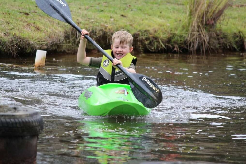ALL SMILES: Levi Ilott, 6, having the time of his life on the water at the Bendigo Canoe Club's whitewater camp at Eildon. Picture: REBECCA MANDERSLOOT 
